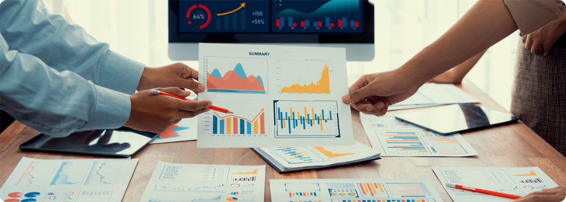 Business professional analyzing scattered reports and graphs, showing the challenge of inconsistent data and analytics.